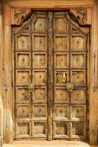 brown wooden door with gold door knob